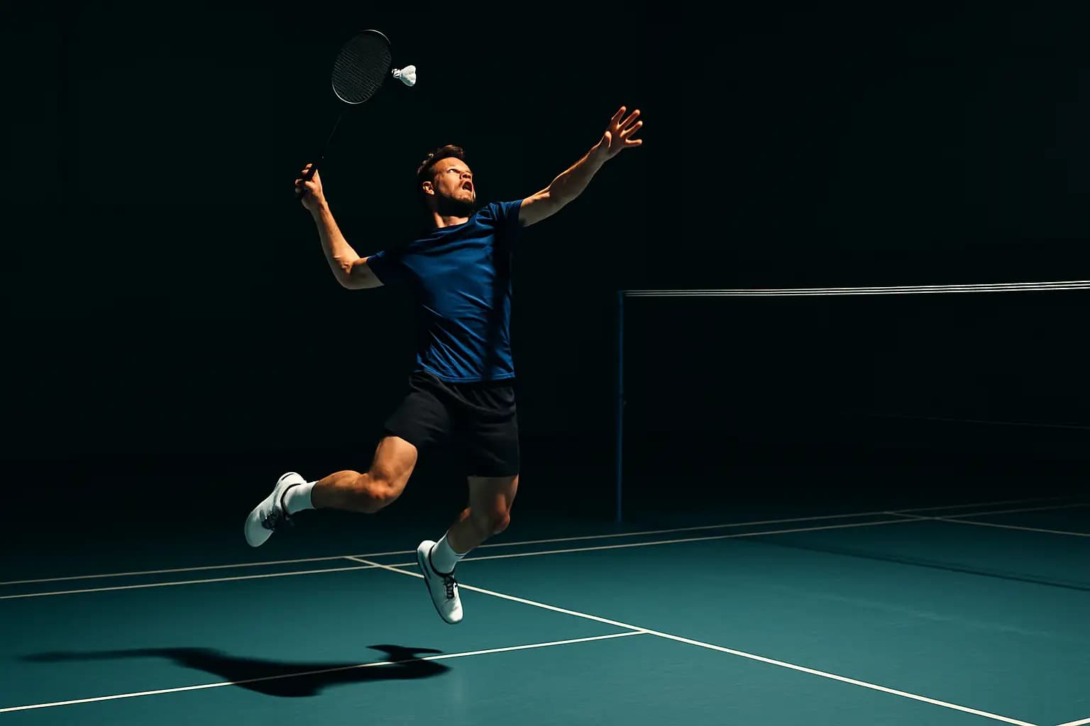 A badminton player mid-jump executing a powerful overhead smash on an indoor court